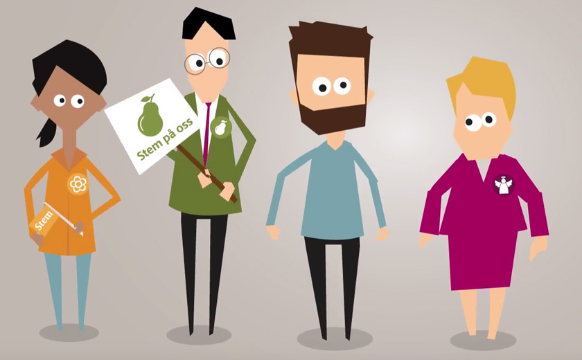 Fire personer står ved siden av hverandre. De har pins på brystet som viser partitilhørighet og en av personene holder en plakat.